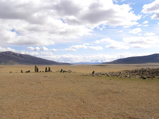 Fototapeta na wymiar Ancient gravestones in the steppes of the Mongolia. Mongolian Cemetery