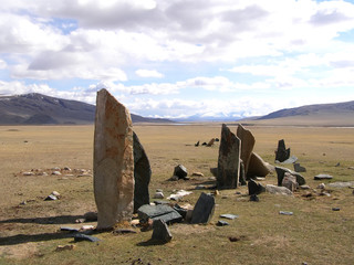 Ancient gravestones in the steppes of the Mongolia. Mongolian Cemetery.