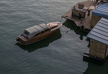 Fototapeta na wymiar Wooden boat standing docked at sava river