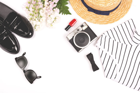 French style monochrome outfit of the day. Minimal and elegant clothes set. Flat lay, top view. Copy space for your text. Horizontal.