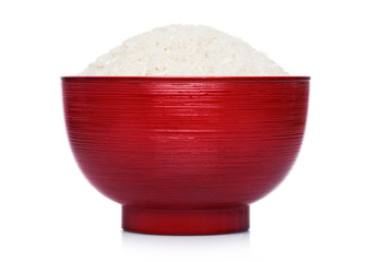 Red bowl of raw organic basmati rice on white background.Healthy food