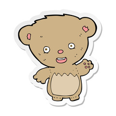 sticker of a cartoon teddy bear waving