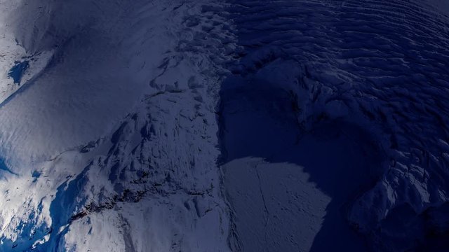 Sunrise on icy surface satellite view, night to day shadows animation. Contains public domain image by Nasa