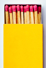 Open yellow matchbox. Matches, object