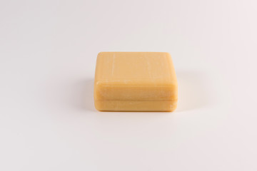 piece of beige soap isolated on a white background