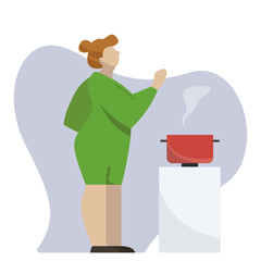 Woman cooking hot dinner at the kitchen