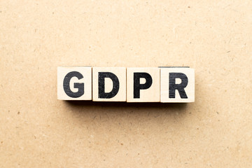 Alphabet letter block in word GDPR (General Data Protection Regulation) on wood background