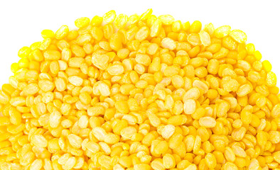 yellow split mung dal or moong dal pile isolated on white background 