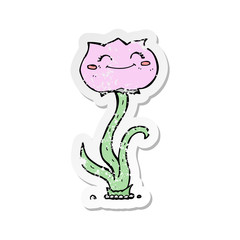 retro distressed sticker of a cartoon flower