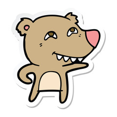 sticker of a cartoon bear showing teeth