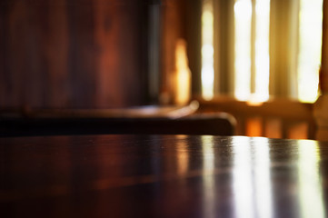 top of dark brown wood table background with light window interior background