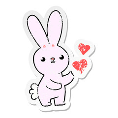 Obraz premium distressed sticker of a cute cartoon rabbit with love hearts
