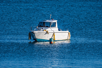 A floating boat, waiting for high tide