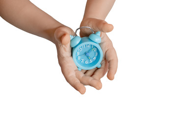 children's hands holding a clock isolate.