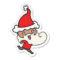 happy bearded man wearing santa hat