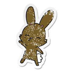 distressed sticker of a curious bunny cartoon