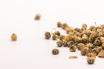 Dried Chrysanthemum petal flower on isolate white background.Blurred close up  Chrysanthemum flower buds and tea on white background.