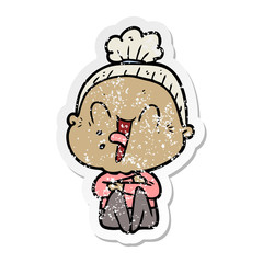 distressed sticker of a cartoon happy old woman