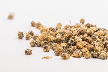 Dried Chrysanthemum petal flower on isolate white background.Blurred close up  Chrysanthemum flower buds and tea on white background.