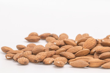 Raw natural organic close up Almonds on isolate white background.Close up Almond seeds.
