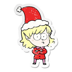 distressed sticker cartoon of a elf girl staring wearing santa hat