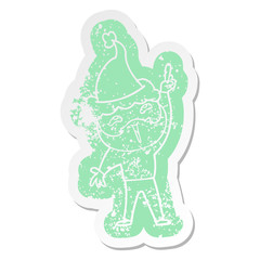 cartoon distressed sticker of a happy bearded man wearing santa hat