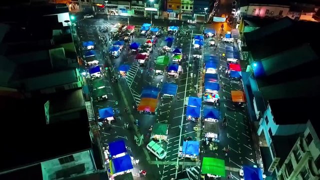 Top Night Aerial View of a night Market in the city of Kota Kinabalu - Malaysia - Crane Up 