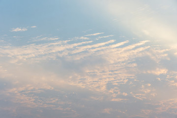 Blue sky with white clouds, the sun rises.