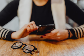 Woman texting on her phone