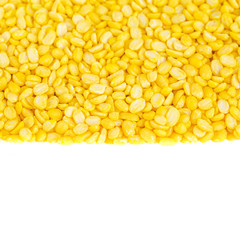 yellow split mung dal or moong dal pile isolated on white background 