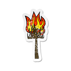 retro distressed sticker of a cartoon tree on fire