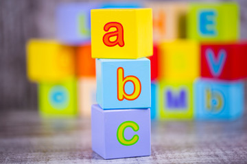 Colorful wooden alphabet; a, b, c write. Education concept photo.