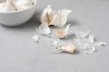 Fototapeta na wymiar Garlic Bulbs with Garlic Clove on Gray Counter