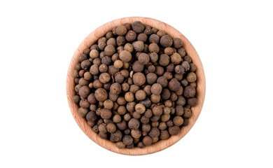 allspice in wooden bowl isolated on white background. Spices and food ingredients.