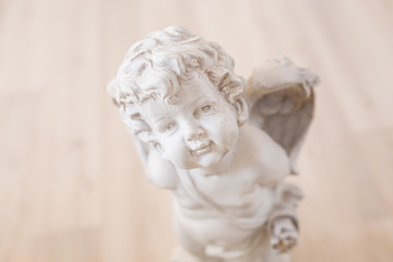figurine and interior concept - white ceramic angel