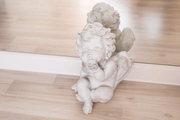 figurine and interior concept - white ceramic angel