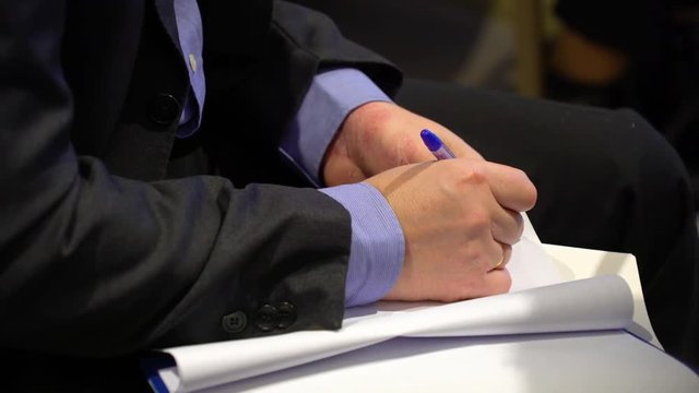Hands writing
