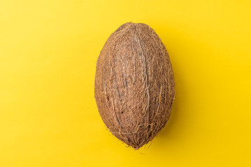 Coconut on yellow background.