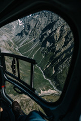 Shot of a mountain through the helicopter window