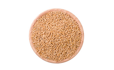 white mustard in wooden bowl isolated on white background. Spices and food ingredients.