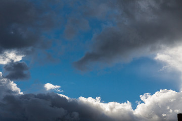 Dark clouds interspersed with white clouds