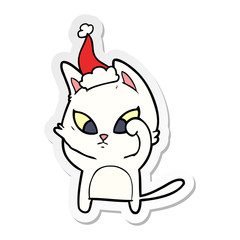 confused sticker cartoon of a cat wearing santa hat