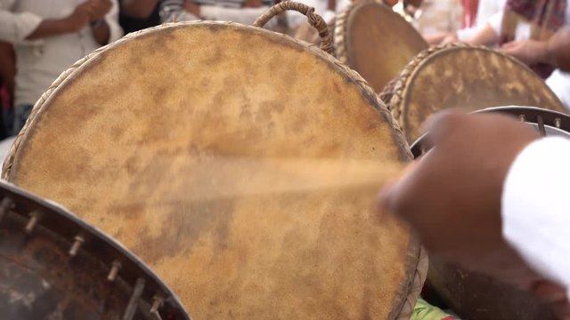 Man playing on a drum on time Pushkar Camel Mela near holy city Pushkar, Rajasthan, India, close up. Drums hands, movement, rhythm