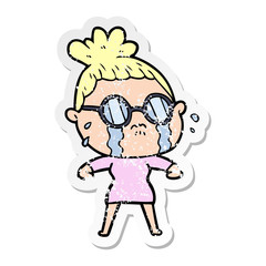 distressed sticker of a cartoon crying woman wearing spectacles