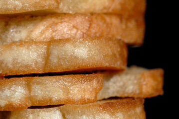 White toasted bread in a pile closeup. Shallow depth of field
