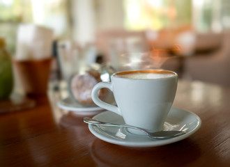 Selective focus of hot coffee on the table