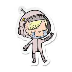 sticker of a cartoon crying astronaut girl