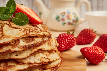 homemade pancakes with strawberry jam and fresh strawberries