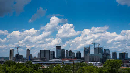 Fototapeta na wymiar Nashville City Skyline with Beautiful Summer Afternoon Sky