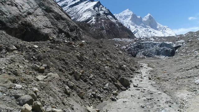 Gomukh Uttarakhand, India is 18 km from Gangotri in the foothills of Bhagirathi at a height of 4255m. It is the snout of the Gangotri Glacier. Around the snout, nature presents a wild topography.